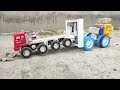 RC tow truck rescuing a stuck truck.
