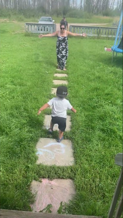 Toddler carefully rushes down the stairs, and around grandma to get to grandpa!