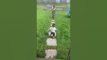 Toddler Carefully Rushes Down The Stairs And Around Grandma To Get To Grandpa 