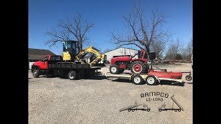 Rampco Ez-Load - Municipal Truck Hauling 2 Pieces Of Equipment