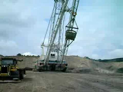 Drag Line operating in lignite mine. Outside view.