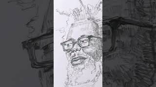 The man wearing glasses