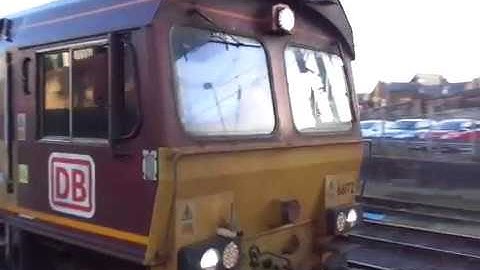 The Class 66 DB Cargo UK (EWS) No.66172 with Rail Containers was leaves at Carlisle Citadel Station.