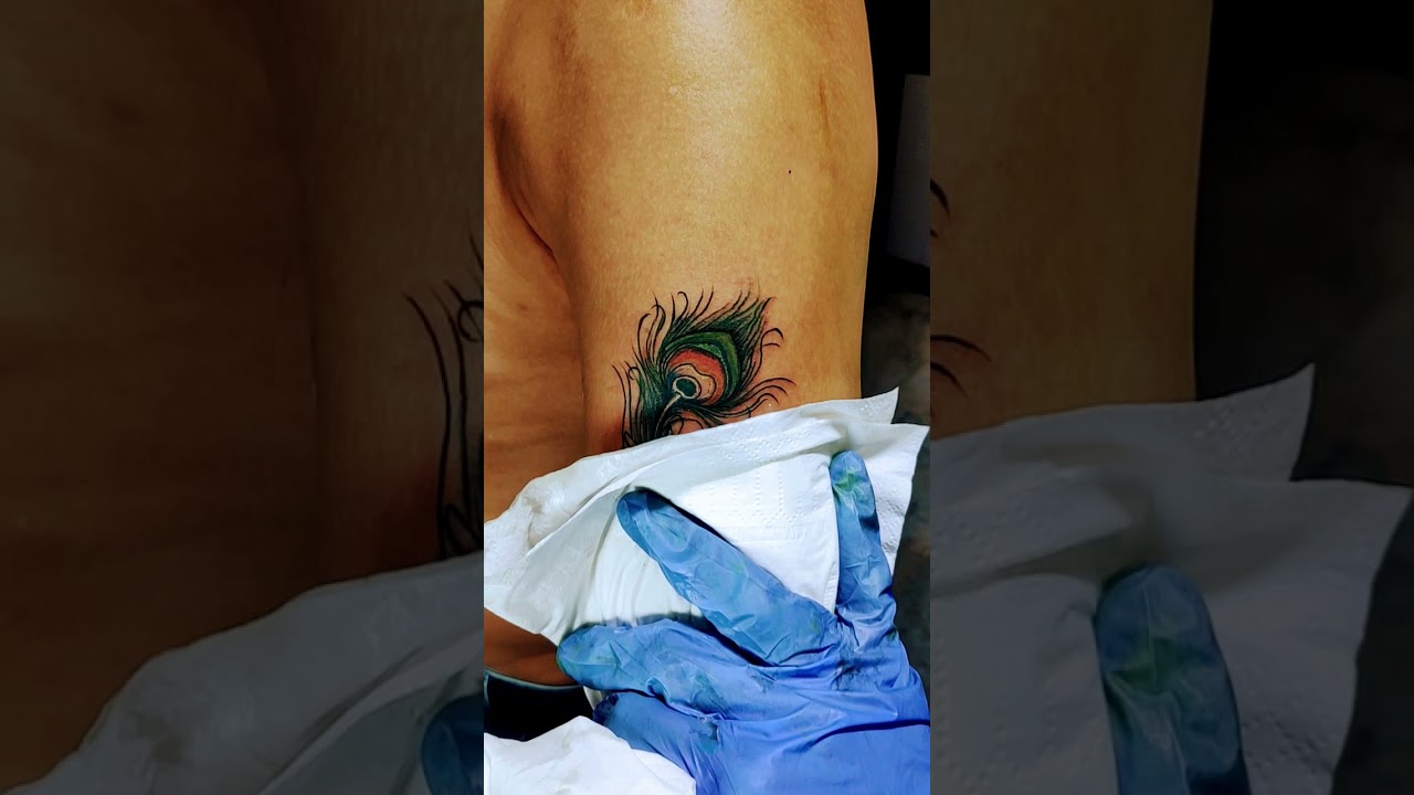 Hare krishna | Flute tattoo with peacock feather.. 