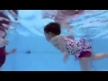 Baby in the pool swimming