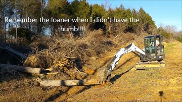 Bobcat E42 Mini Excavator Pulling Heavy Logs from wet ditch