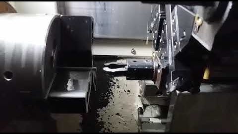 Bar puller operation on CNC lathe.
