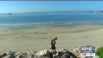 Power plant workers pick up trash at Fisherman