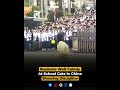 Students Wait Calmly At School Gate in China Showing Discipline