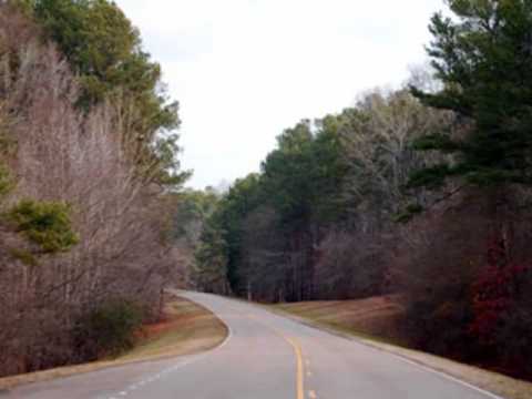 This video shows some of the attractions on and near the Natchez Trace Parkway near Tupelo, Mississippi from milepost 281 to milepost 248. Pictured are Chickasaw Council, Black Belt Overlook, Chickasaw Village, Tupelo Visitors Center, Confederate Gravesites, Dogwood Valley, Brices Cross Roads National Battlefield Site, Elvis Presley Birthplace, Baldwyn, Mississippi and Tupelo, Mississippi. Additional pictures, information and maps can be found at www.NatchezTraceTravel.com