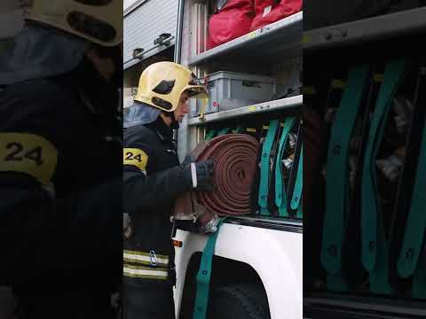 Fireman Rolling Out Water Hose [Short]