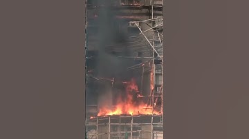 People reportedly trapped as fire engulfs Hong Kong residential high-rise