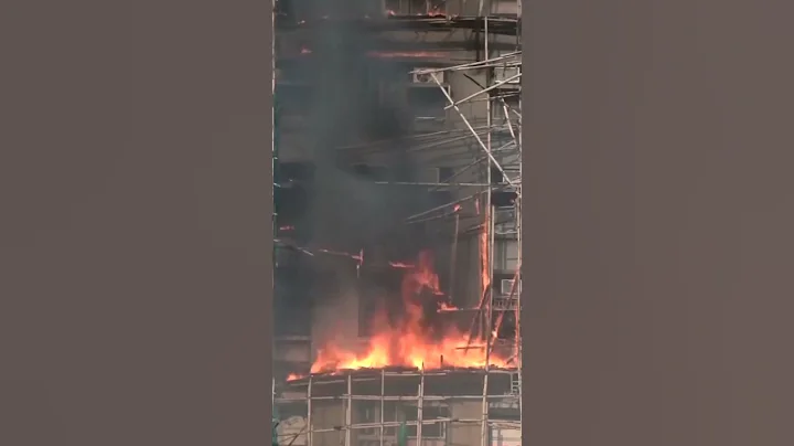 People reportedly trapped as fire engulfs Hong Kong residential high-rise