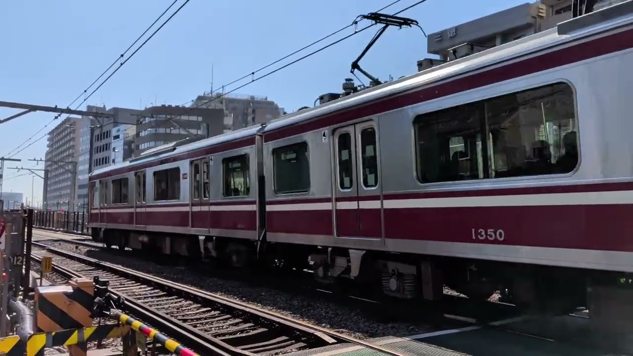 2月21日、11時14分、京急本線北品川第1踏切下り線側からの撮影、京急新1000形1354〜1349普通品川行通過