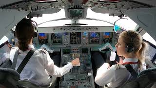 : Cockpit view of the Embraer 195 flown by two female airline pilots