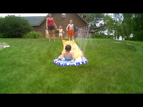 Robert, Maddux, and Griffin on the slip n slide 1