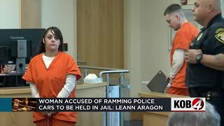 Woman accused of ramming into police cars to be held in jail