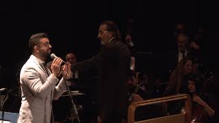 Play video: Michel El Khoury - Alouli chaarik majnoun - Conducted by Andre Hajj - قالولي شعرك مجنون