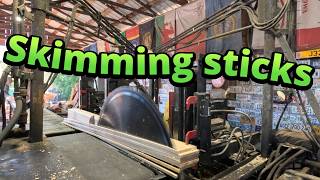 Sawing spruce skimming sticks # 929
