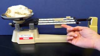 Measuring mass with a triple beam ballance.mp4
