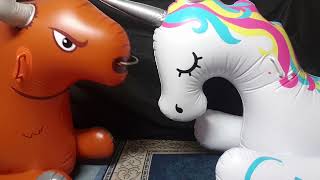 Bigmouth Inflatable Bull Rocker checking out the Bigmouth Inflatable Unicorn Rocker