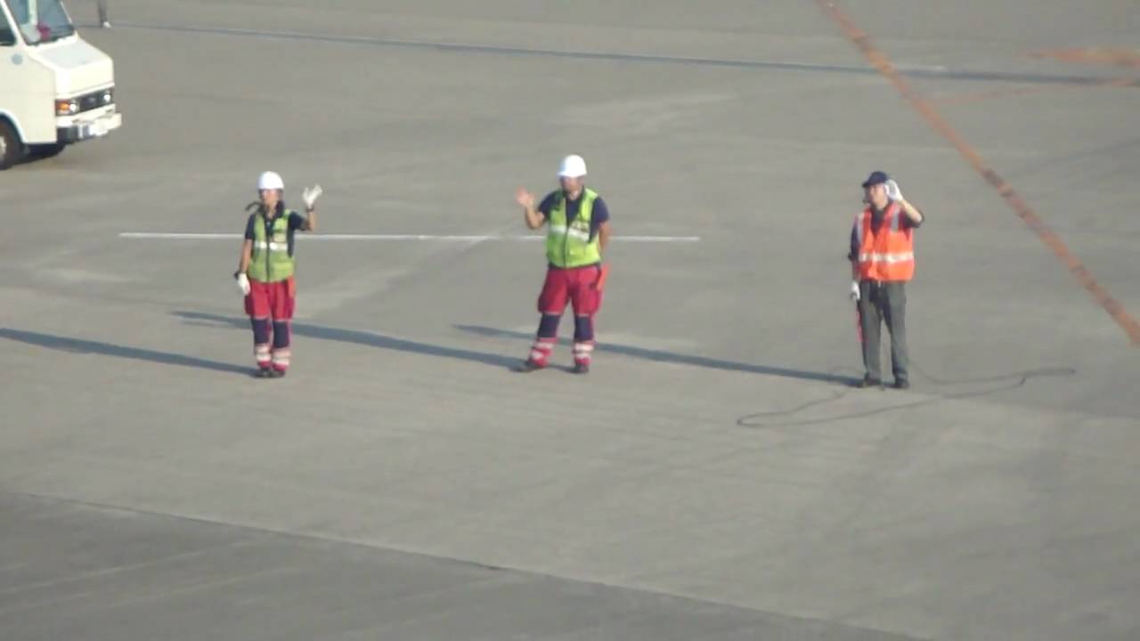 Narita Ground Crew Waving Goodbye to Departing Plane (Tokyo, Japan) HD