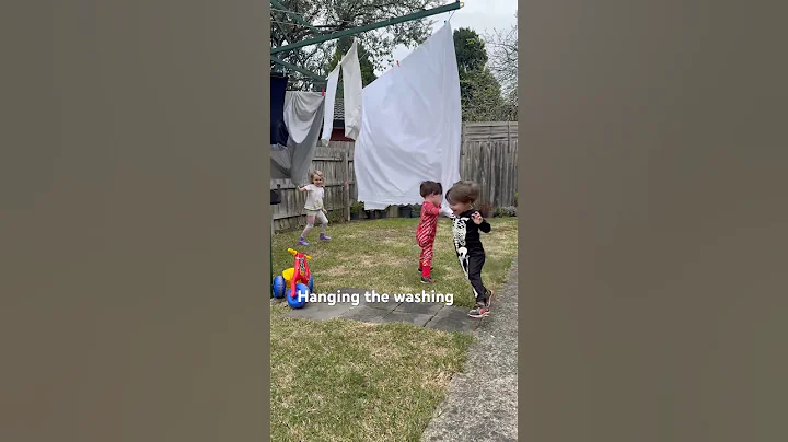 Helping mom hang the washing 😂 #mom #washing #clothesline #cute #funny #adorable #twins #family
