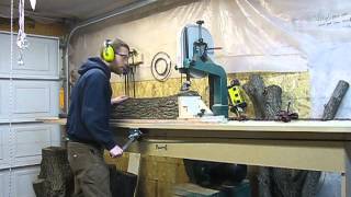 A 14 inch bandsaw set up with a jig to resaw modest trees into lumber.