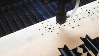 Suny Laser 80W laser cutter at work on 4mm birch plywood