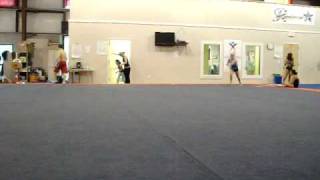 Rick spotting a double back on floor exercise