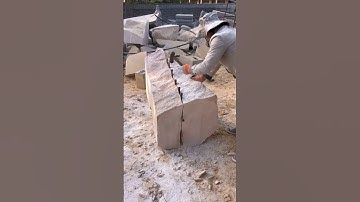 Cutting stone with a hammer chisel- Good tools and machinery make work easy