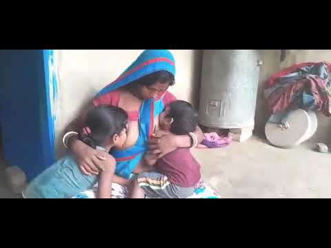 Breast feeding her baby's||Indian mom feeding milk