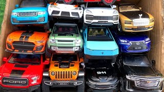 Box Full of Model Cars-Toyota Supra, Porsche Cayenne, Rolls Royce Spectre, Range Rover, Jeep Rubicon