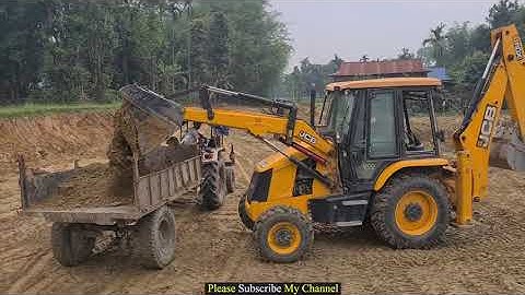 Jcb backhoe  leveling hill land and loading soil in tractors