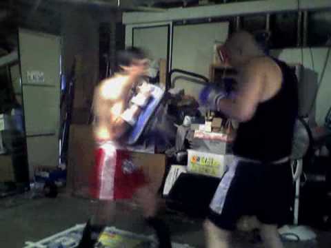 Teaching my bro how to use the thai pads. (not a m...