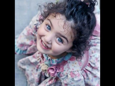 Premium Photo | Baby girl with long hair pose on black background