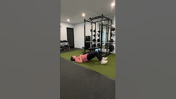 Bridge with yoga block adductor squeeze (side view)