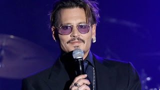 Johnny Depp accepts the Rhonda's Kiss Healing and Hope Award on stage