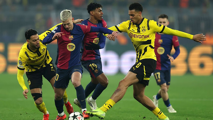 Ferran Torres scored twice to help Barcelona secure a 3-2 win over Dortmund,advancing to the Champio