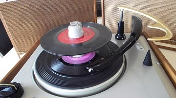 Magnavox Micromatic Transistorized STEREO record player playing a stack of 45