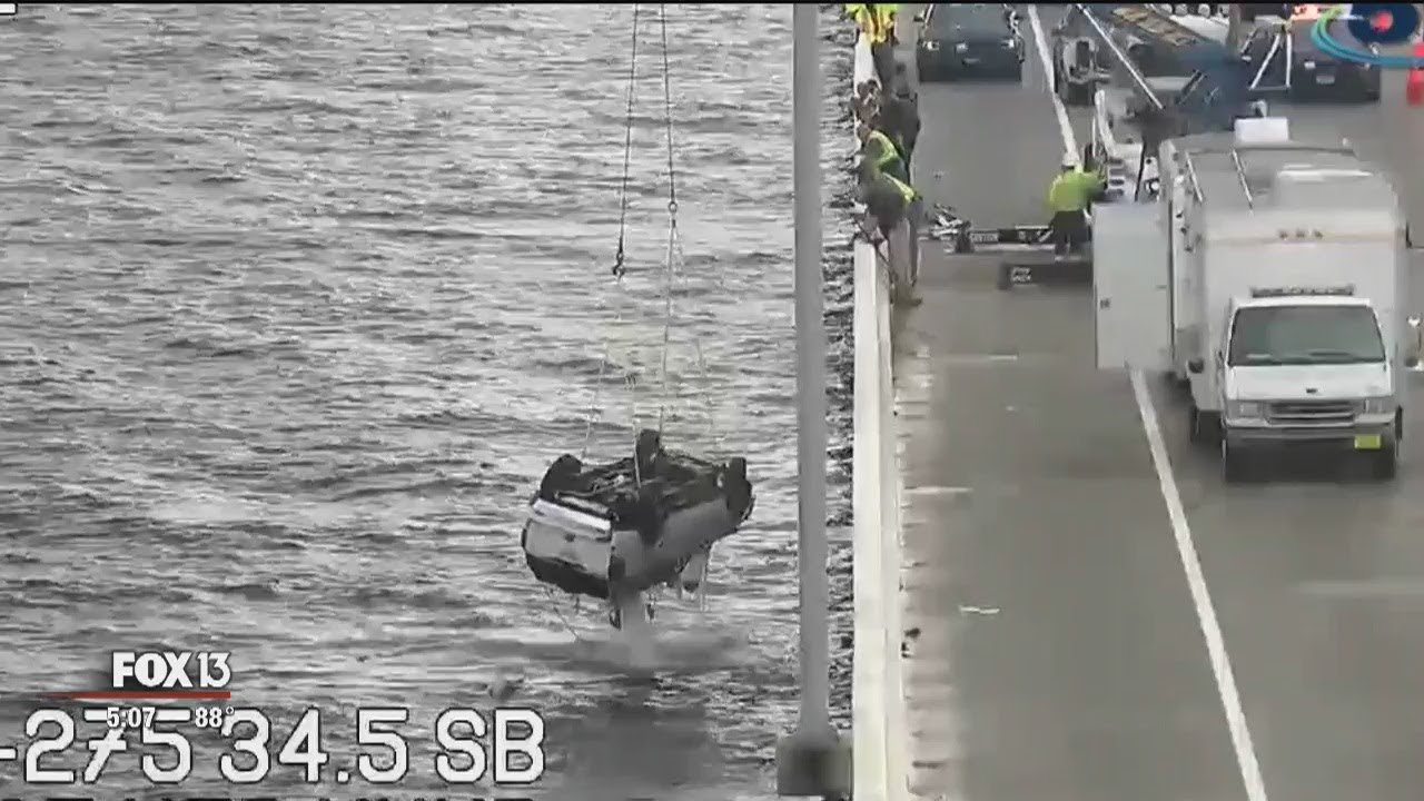 Driver still missing after SUV flips into Tampa Bay - YouTube