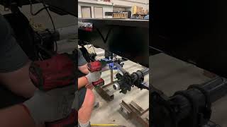 Connecting the axles of 83'x16' Tandem Axle Utility Trailers
