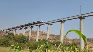 01487 Pune Harangul special crosses the majestic Dharashiv/Osmanabad bridge with WDP4D in lead.