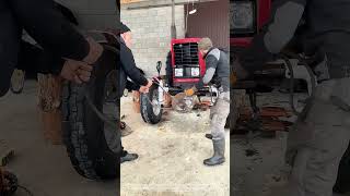 Two-Person Torque: Using a Pull Bar to Free a Tractor’s Front Axle
