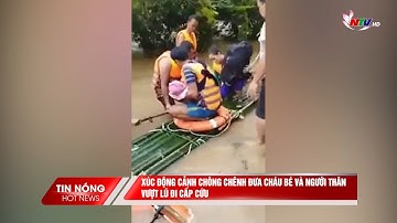 Xúc động cảnh chông chênh đưa cháu bé và người thân vượt lũ đi cấp cứu