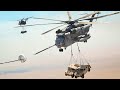 US Skilled Helicopter Pilots Carry Two Humvees While Refueling