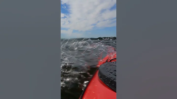 Waves splashing alongside kayak