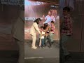 #RamCharan signs an autograph for his young admirer, who then touches his feet.
