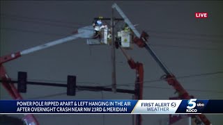Power pole ripped apart, left hanging after crash in northwest Oklahoma City