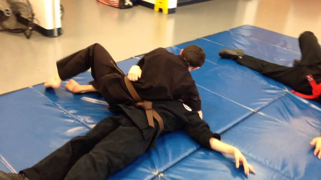 Leg sweep takedown to Americana armlock. YouTube